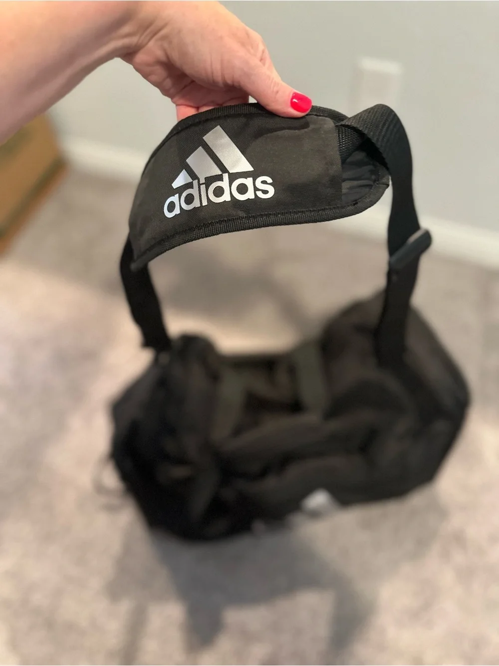 black adidas Defender duffel bag with White Logo